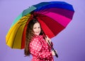 Bright umbrella. Be rainbow in someones cloud. Rainy day fun. Happy walk under umbrella. Enjoy rain concept. Kid girl Royalty Free Stock Photo