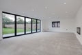 Bright unfurnished living room with Bifold patio doors
