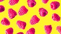 Bright vibrant red raspberries on neon yellow background. Top view. Summer fresh wallpaper.