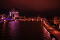 Bright view on the night city, river and skyscraper. Royalty Free Stock Photo
