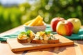 bright view of pear bruschetta on picnic table