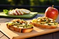 bright view of pear bruschetta on picnic table