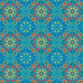 Bright vivid red and blue floral symmetrical repeating pattern in Islamic style