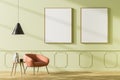 Bright waiting room interior with armchair and two empty poster Royalty Free Stock Photo