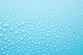Bright water droplets on soft light gentle frosty blue background as fresh pattern of small shine drops with gradient, texture. Royalty Free Stock Photo