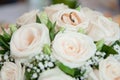 Bright wedding bouquet of summer flowers with wedding rings