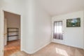 Bright white apartment entryway carpet and hard wood flooring real estate