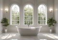 Bright White Bathroom Interior with Freestanding Tub Three Arched Windows and Potted Plants Royalty Free Stock Photo