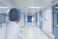 Bright, white with blue doors, a sterile corridor in a medical facility. Royalty Free Stock Photo