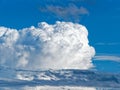 Huge white Cumulus cloud towering in the blue sky Royalty Free Stock Photo