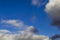 Bright white with grey clouds on blue sky. Beautiful background Royalty Free Stock Photo