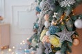 Bright White Interior with Christmas New Year Tree decor and lights bokeh on the background Royalty Free Stock Photo