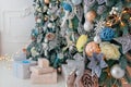 Bright White Interior with Christmas New Year Tree decor and lights bright bokeh on the background Royalty Free Stock Photo