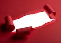 Bright white light shines through a torn red paper scroll with rolled edges Royalty Free Stock Photo