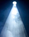 Bright White Spotlight Beam Cutting Through Smoke in Dark Stage Background Royalty Free Stock Photo