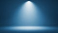 Bright white spotlight beam illuminating a dark blue studio background with a soft light gradient Keywords Royalty Free Stock Photo