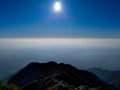 Bright winter sun illuminating mountain hill in Mussoorie, Uttarakhand, India. Captivating winter scenery