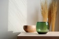 Bright wood top green counter and warm white wall grass glass vase mug. Modern kitchen illustration. Royalty Free Stock Photo