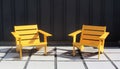 Bright Wooden Chairs on Large Stone Pavers, Ultra Modern or Mid Century Modern