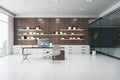 Bright wooden and concrete office interior with furniture, bookshelves with books, window with city view and daylight. Work and