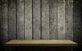 Bright wooden shelf display on grungy wood wall Royalty Free Stock Photo