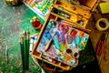 Bright Colorful workplace of the artist with brushes and oil paints