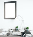Bright workplace with empty frame Royalty Free Stock Photo
