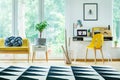 Bright workspace with yellow chair