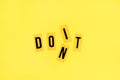 Bright yellow background with letters. Motivational concept, just do it.