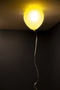 Bright yellow ballon in a living room