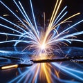 Bright Yellow and Blue Sparks Exploding Over Reflective Surface explosion fire Royalty Free Stock Photo