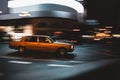 Bright yellow car on a bustling city street in motion blur