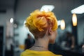 Bright yellow colored hair in short punkish hairstyle. Royalty Free Stock Photo