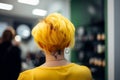 Bright yellow colored hair in short punkish hairstyle. Royalty Free Stock Photo