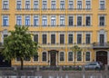 Bright yellow facade of the historic building facade in the city