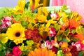 Bright yellow gerbera and alstroemeria in a bouquet of flowers.