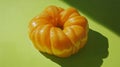 Bright Yellow Glazed Donut on Green Background Royalty Free Stock Photo