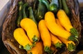 Bright yellow and green zucchini in basket