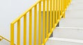 Bright Yellow Handrail Along White Staircase In Modern Interior stairs railing Royalty Free Stock Photo