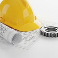 Yellow Hard Hat Blueprint and Metal Gear on White Background construction engineering Royalty Free Stock Photo