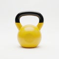 Bright yellow kettlebell with black handle isolated on white background Royalty Free Stock Photo