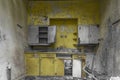 Bright yellow kitchen in an abandoned house