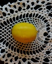 Bright Yellow Lemon, White Lace, Black Background Royalty Free Stock Photo