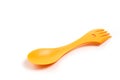Bright yellow, light, plastic tourist spoon-fork on a white background Royalty Free Stock Photo