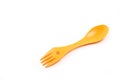 Bright yellow, light, plastic tourist spoon-fork on a white background Royalty Free Stock Photo