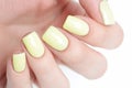Bright yellow manicure with black stripes and sunflowers pattern on white background Royalty Free Stock Photo