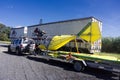 Bright yellow microlight aircraft on car trailer Royalty Free Stock Photo