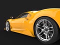 Bright yellow modern luxury sports car - rear wheel closeup shot Royalty Free Stock Photo