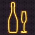 Bright yellow neon champagne bottle and glass Royalty Free Stock Photo