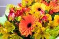 Bright yellow and orange gerbera in a bouquet of flowers. Beautiful bouquet gift for the holiday.